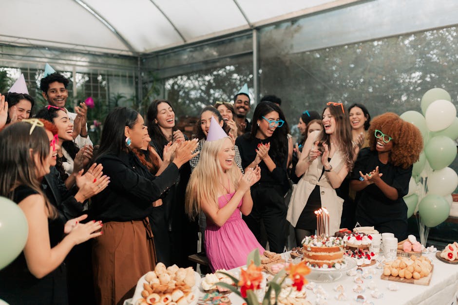 Joyful indoor birthday party with friends, laughter, and a decorated cake.