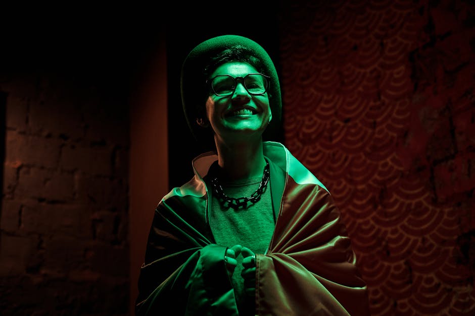 A smiling woman celebrates St. Patrick's Day wrapped in an Irish flag.