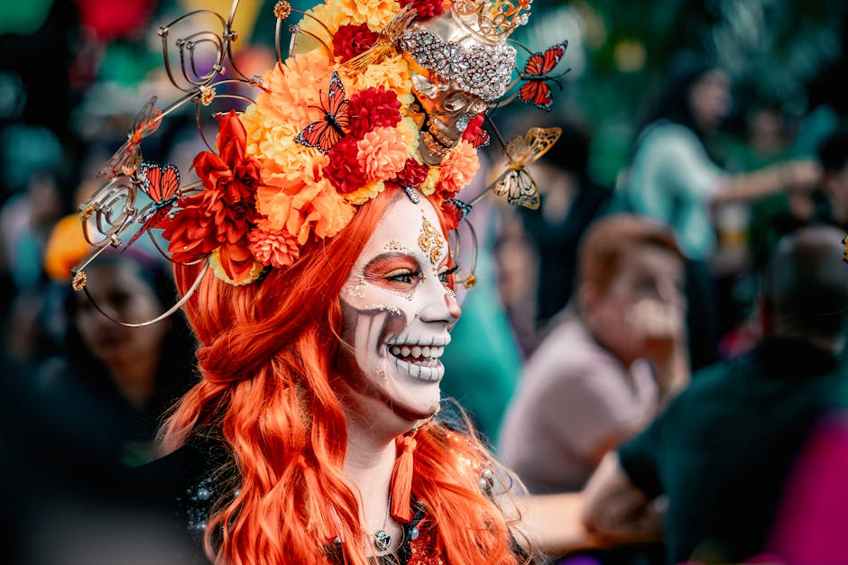 Vibrant Day of the Dead participant with a floral headpiece and face paint.