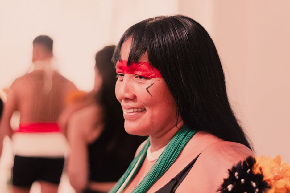 Portrait of a smiling person in traditional attire during a cultural celebration.